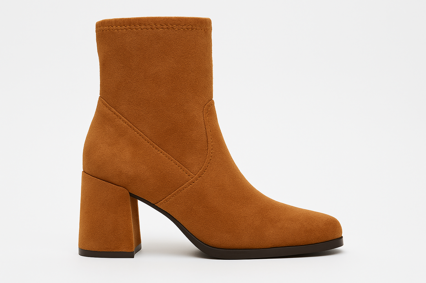 Brown ankle boot with a block heel on a white background