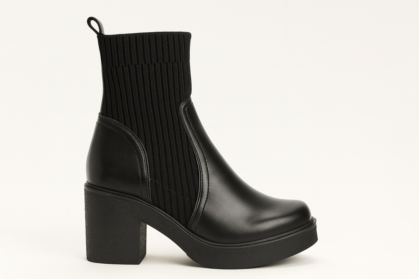 Black ankle boot with chunky heel on a white background