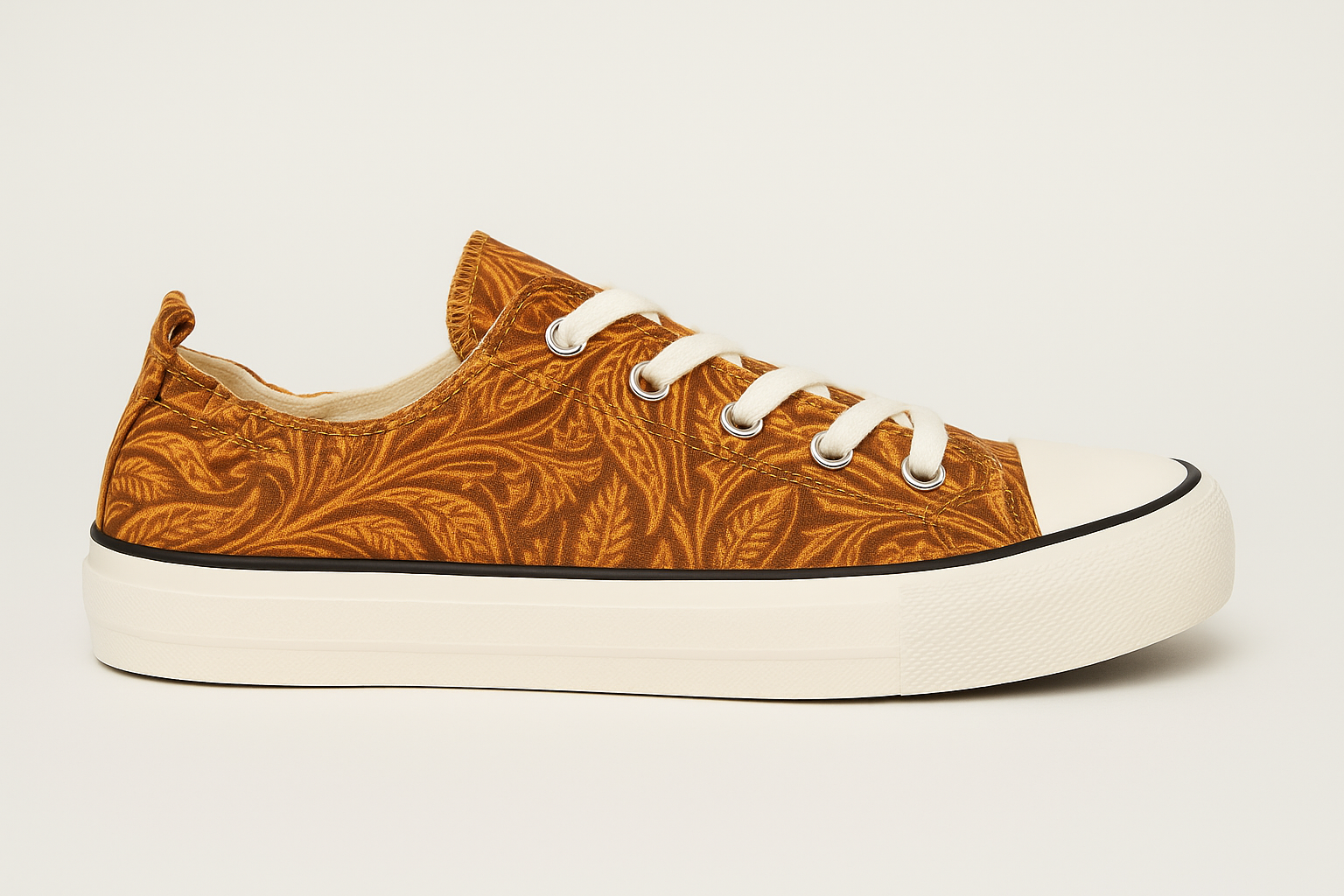 Brown patterned sneaker with white laces on a light gray background