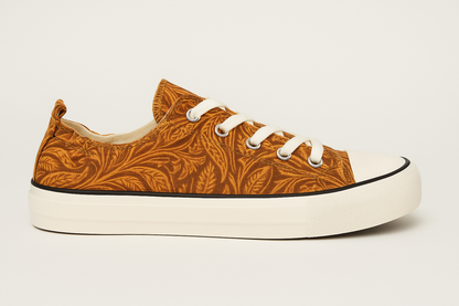 Brown patterned sneaker with white laces on a light gray background
